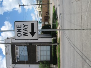 one way metal street sign